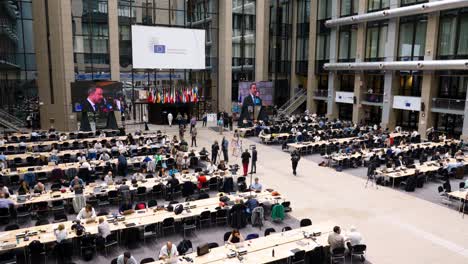 Main-press-room-in-the-Justus-Lipsius-building-during-the-European-Council-summit-in-Brussels,-Belgium---Static-shot