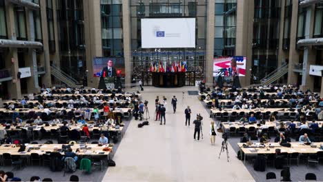 Main-press-room-in-the-Justus-Lipsius-building-during-the-European-Council-summit-in-Brussels,-Belgium---Wide-angle