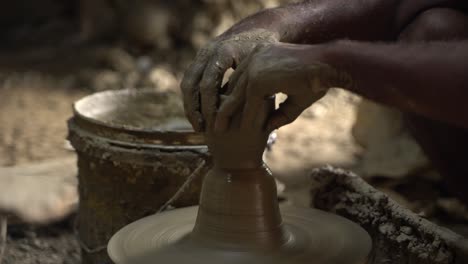 A-potter-is-making-clay-objects-with-a-pot