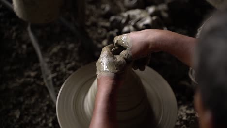 A-potter-is-making-clay-objects-with-a-pot