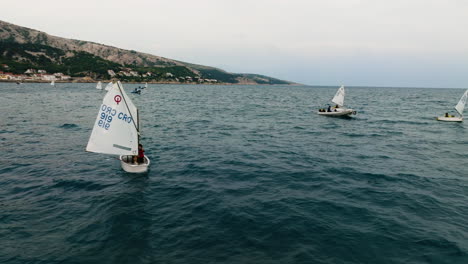 Boats-Sailing-In-The-Scenic-Seascape-In-Baska,-Krk,-Croatia---drone-shot