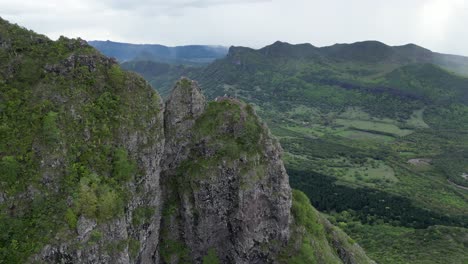 People-on-the-mountain-top-in-Mauritius,-aerial-mountain-landscape