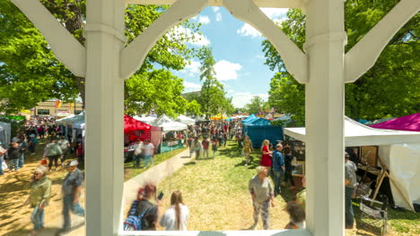 Crowds-of-people-enjoy-Dogwood-Festival-booths-entertainment-in-Siloam-Springs,-Arkansas---Timelapse