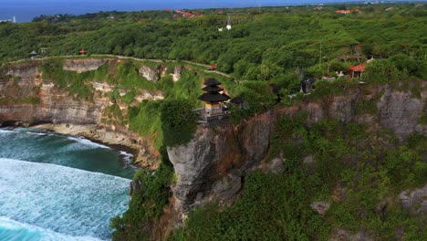 Uluwatu-Temple-And-Cliff-Beach,-Bali,-Indonesia---aerial-drone-shot