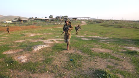 Soldiers-walking-on-the-field-and-picking-up-practice-grenade