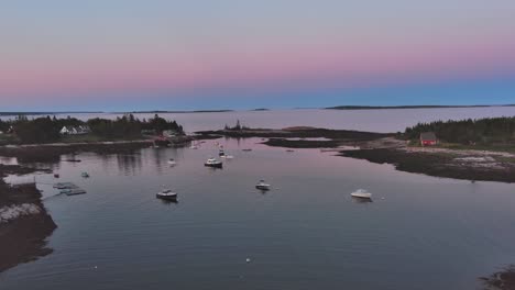Blue-hour-light-beyond-Cape-Harbor,-Dynamic-aerial-shot-tracking-in