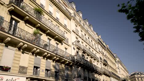 Apartment-buildings-in-the-Haussmann-style-architecture-on-the-center-of-the-city,-Back-from-vehicle-left-view-shot
