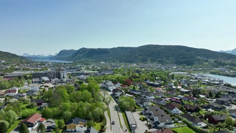 Rising-aerial-at-Spjelkavik-and-Moa-while-looking-towards-Brusdal-freshwater-lake---Summer-aerial-Norway