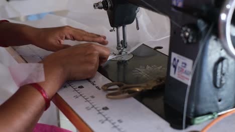 close-up-scene-of-sewing-by-an-Indian-woman-who-earns-her-living-by-doing-this-sewing