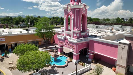 Aerial-pullback-view-of-iconic-pink-Casa-Bonita-Mexican-restaurant-in-Lakewood