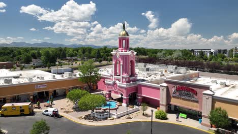 Popular-Casa-Bonita-with-pink-exterior-at-Lamar-Station-Plaza,-aerial-view