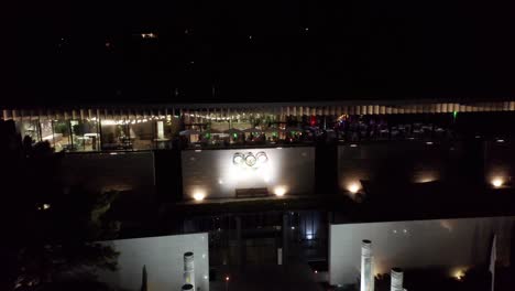 Dolly-of-a-luxurious-party-on-the-second-floor-of-the-Olympic-Museum-in-Lausanne,-Switzerland-at-night