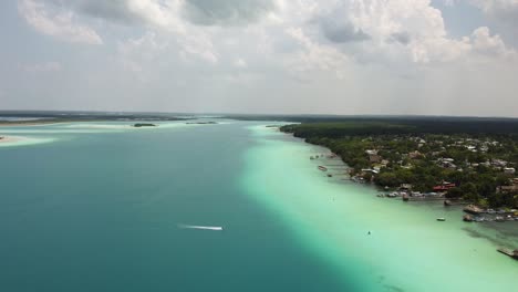 Drone-Shot-of-Lake-Bacalar-and-a-jet-ski-in-Quintana-Roo,-Mexico,-Aerial-View