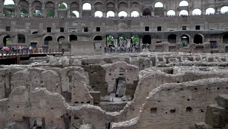 Overlooking-The-Hypogeum-At-The-Colosseum-In-Rome-With-Slow-Motion-Pan-Up-Shot