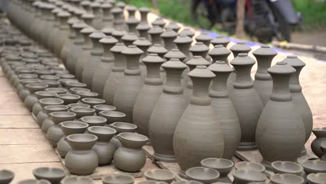 Various-items-made-of-clay-are-left-to-dry-in-the-sun