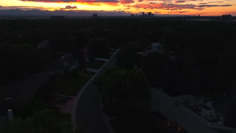 Bright-orange-sunset-over-housing-neighborhood-in-suburb-of-American-city