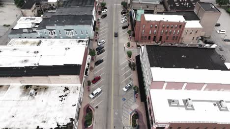 Downtown-Elkhart,-Indiana-with-drone-video-looking-down-and-tilting-up