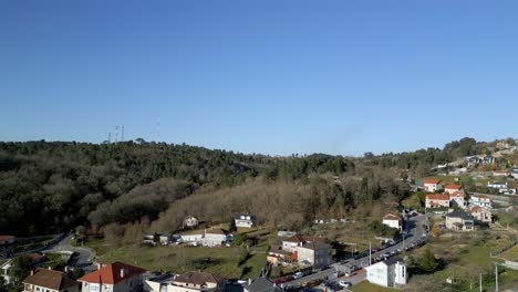 Aerial-drone-footage-of-sunny-mountain-town-and-clear-blue-skies