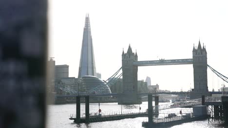 cityscape-london-tower-bridge,-the-shard,-shard-skyscraper,-cinematic-shot-panoramic-movement,-establishment-shot-during-bright-day,-London-city-tourist-destination