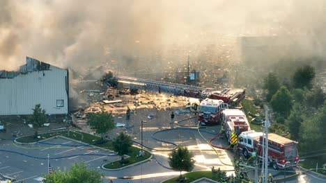 Aerial-view-of-several-fire-trucks-with-ladder-after-gas-explosion-in-American-city-in-Pennsylvania
