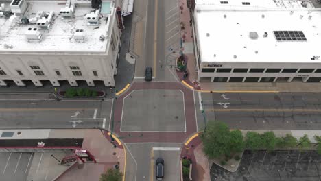 Downtown-Elkhart,-Indiana-with-drone-video-looking-down-at-an-intersection-and-tilting-up