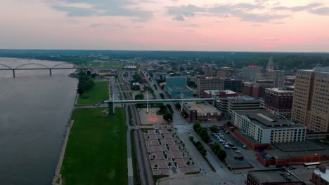 Downtown-Davenport,-Iowa-skyline-during-sunset-with-drone-video-moving-forward