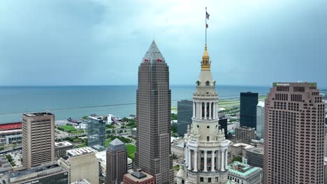 Drone-Shot-of-Downtown-Cleveland-OH-USA-Skyscrapers-and-Waving-Flags-on-Terminal-Tower