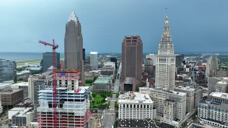Downtown-Cleveland-OH-USA,-Aerial-View-of-Buildings,-Towers-and-Construction-Site-on-Cloudy-Day