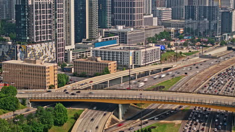 Atlanta-Georgia-Aerial-v880-hyperlpase-drone-flyover-interstate-freeway-capturing-heavy-traffic-on-the-road-and-cityscape-across-Midtown-and-downtown-at-daytime---Shot-with-Mavic-3-Pro-Cine---May-2023