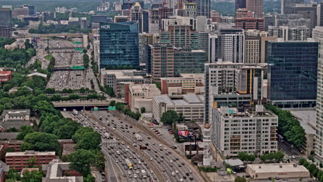 Atlanta-Georgia-Aerial-v876-hyperlapse-birds-eye-view-drone-flyover-hotel-district-capturing-busy-traffic-motion-on-the-freeway-across-tech-square-and-midtown---Shot-with-Mavic-3-Pro-Cine---May-2023