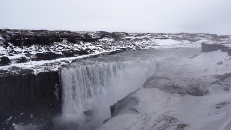 Handheld-shot-of-majestic-Dettifoss-Waterfall-during-winter---Diamond-Circle-in-North-Iceland