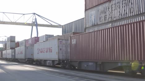 Handheld-shot-of-Mannheim-port-with-large-container-crane-docking-containers