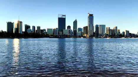Perth-city-skyline-and-foreshore-with-beach-with-Skyscrapers-in-background-of-Swan-River-Western-Australia