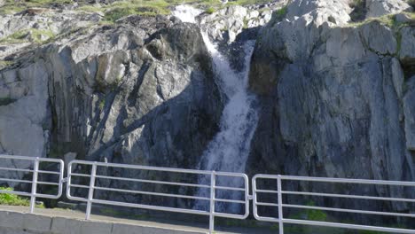 View-from-observation-deck-of-melting-snow-waterfall,-Swiss-Alps,-Rhone-Glacier