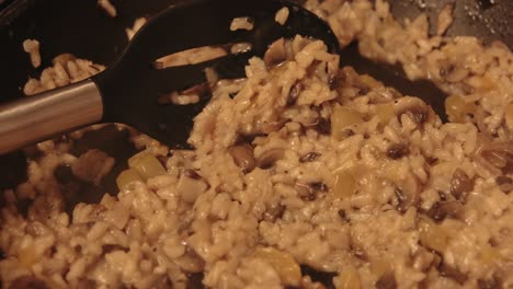 Slow-Pan-of-Chestnut-Mushroom-Risotto-Being-Cooked