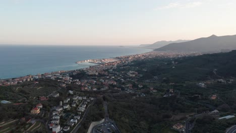 Aerial-reveal-of-a-beautiful-Italian-city-near-the-Mediterranean-sea