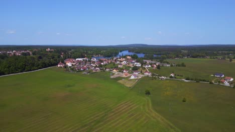 Great-aerial-top-view-flight-Summer-field-at-village-lake-Chlum,-Czech-Republic-2023