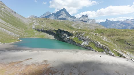 Aerial-of-nearly-dried-up-lake-in-the-Swiss-mountains