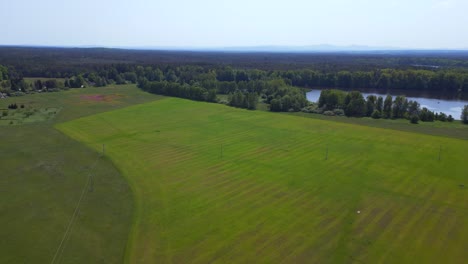 Perfect-aerial-top-view-flight-lake,-pasture,-woods
Summer-field-at-village-Chlum,-Czech-Republic-2023