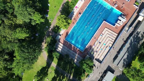 Fabulous-aerial-top-view-flight-public-swimming-pool-Insulaner,-city-berlin-Germany-Summer-day-2023
