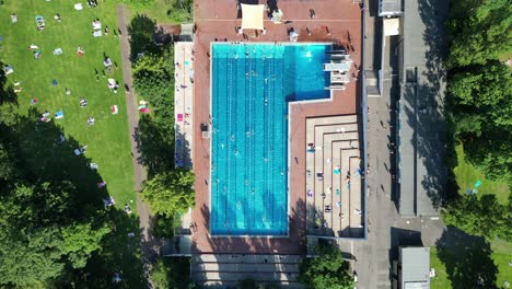 Spectacular-aerial-top-view-flight-public-swimming-pool-Insulaner,-city-berlin-Germany-Summer-day-2023