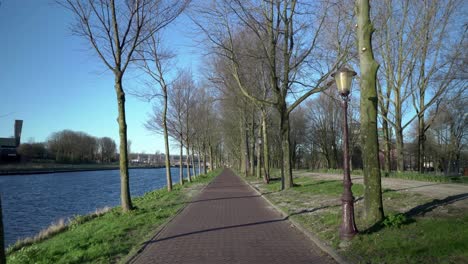 Empty-walkway-at-Riverside-public-Park,-Amsterdam,-slow-motion,-March-2021