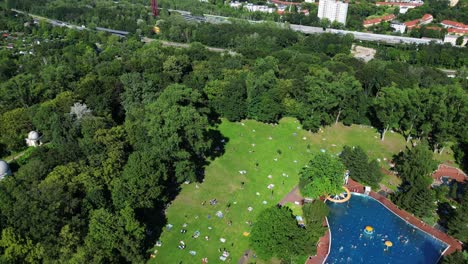 Dramatic-aerial-top-view-flight-public-swimming-pool-Insulaner,-city-berlin-Germany-Summer-day-2023