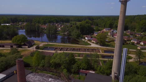 Amazing-aerial-top-view-flight-Chimne,-Solar-field-plant-factory-at-village-Chlum,-Czech-Republic-Summer-2023