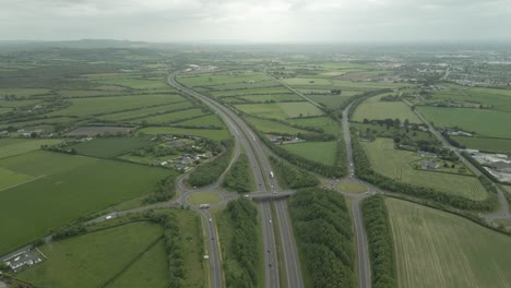 Panoramic-Aerial-View-Of-N7-Road-Motorways-In-County-Laois-And-Portlaoise-Town-In-Ireland