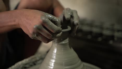 A-potter-is-making-clay-objects-with-a-pot