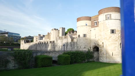 Byward-Tower,-Tower-of-London,-King-Henry-III,-London-city-landmark-bird-flying-by-Capital-of-United-Kingom,-UK,-bright-sunny-spring-summer-weather,-clean-green-grass,-sight,-tourist-famous-highlight