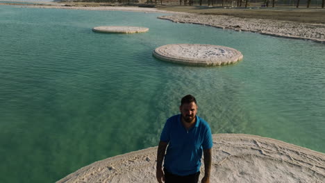 Man-Walking-Over-Salt-Formation-Mushrooms-On-Dead-Sea,-Israel