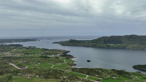 The-Atlantic-Ocean-road-is-seen-in-horizon-background-from-a-distance---High-angle-castal-aerial-view-Norway