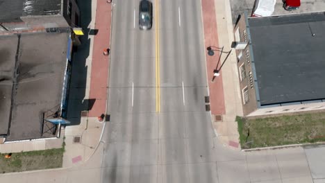 Downtown-Moline,-Illinois-with-drone-video-tilting-up-from-intersection